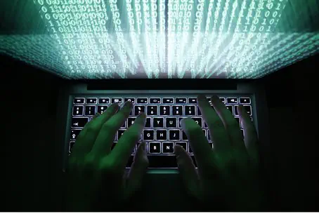 A man types on a computer keyboard A man types on a computer keyboard