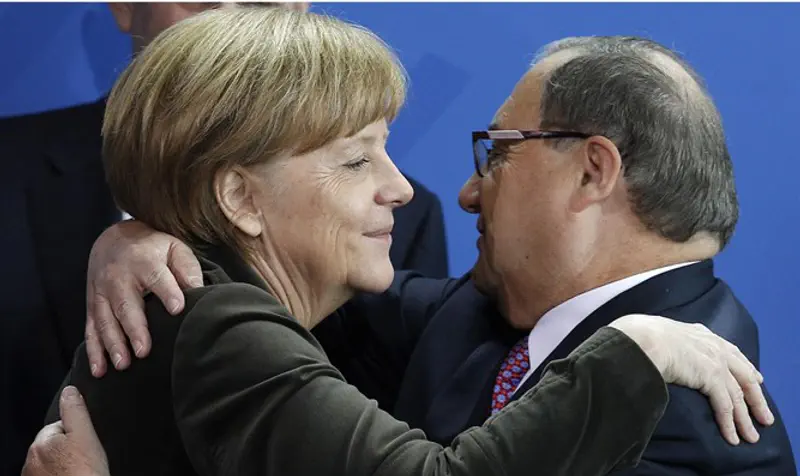 Former National director of the Anti-Defamation League Foxman hugs German Chancellor Merkel