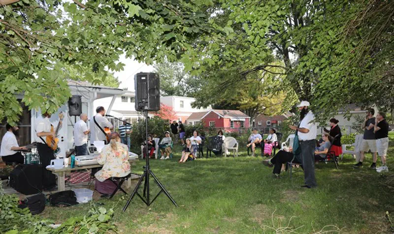 Participants enjoying a concert in the community garden​