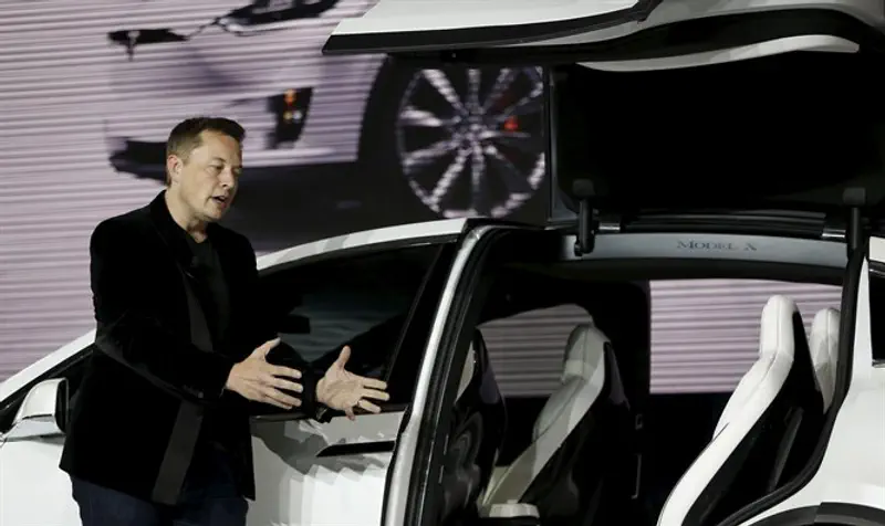 Elon Musk introduces the falcon wing door on the Model X electric sports-utility vehicle
