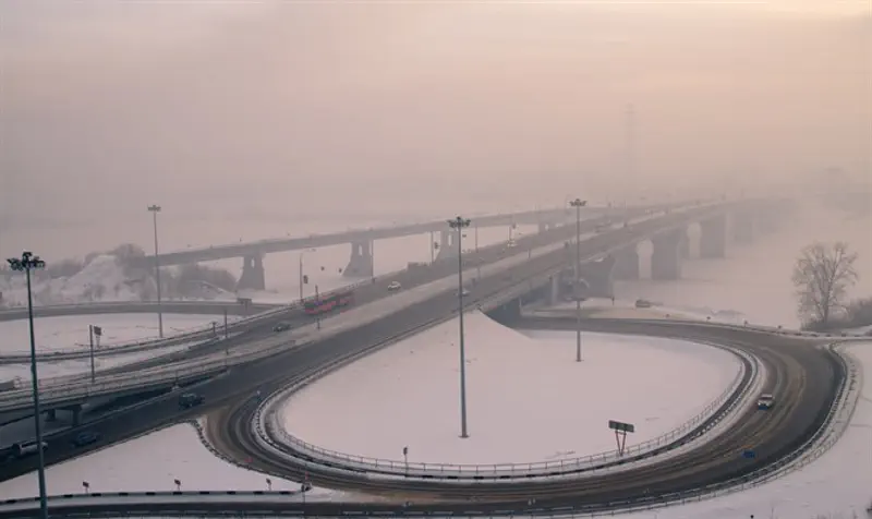 Bridge and road junction in winter fog; Kemerovo, Russia