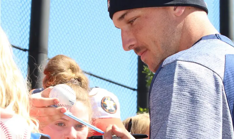 Alex Bregman signs autographs at the Houston Astros' spring training complex in West Palm Beach, Fla.