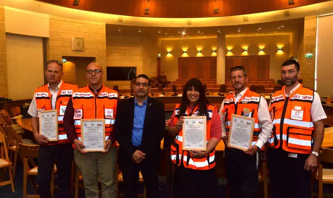 Honorees stand together with Murad Aliyah holding citations of excellence