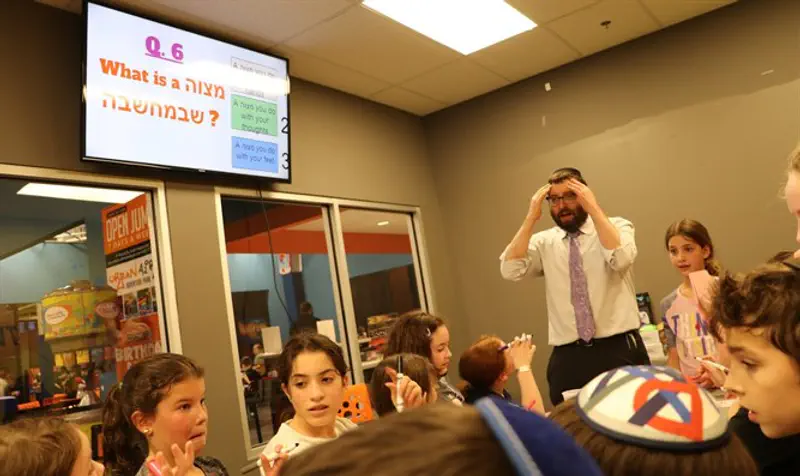 Fifth grade students at Yeshivat Noam in Paramus, N.J., play games to review what they learned.