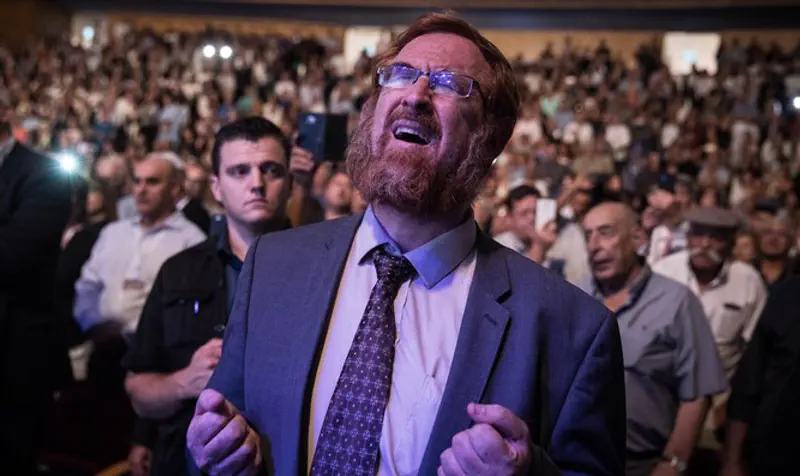 Glick praying Selichot at Likud event