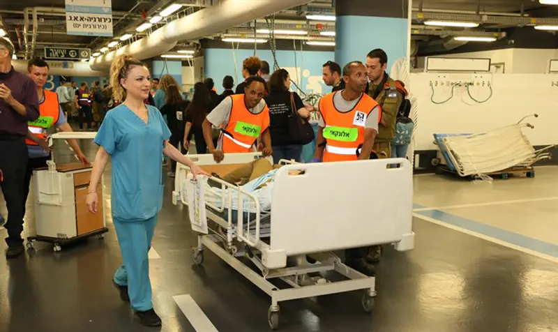 Transferring patients from the main hospital to the underground hospital.