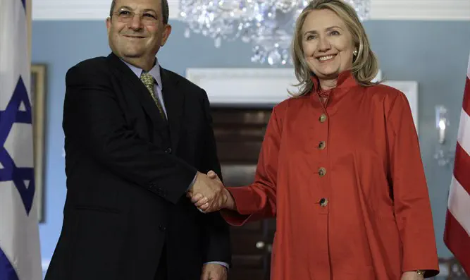Then-US Secretary of State Clinton shakes hands with then-Israeli DM Ehud Barak