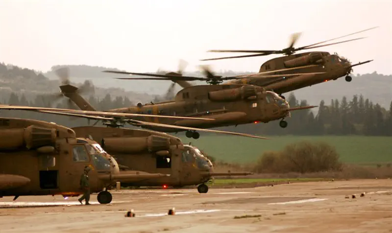 Helicopters in Paratrooper's training exercise
