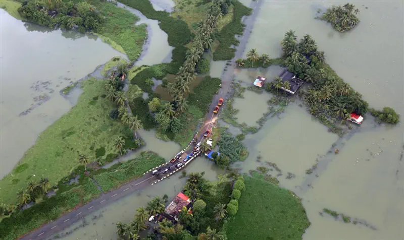 Partially submerged road at flooded area in southern state of Kerala, India