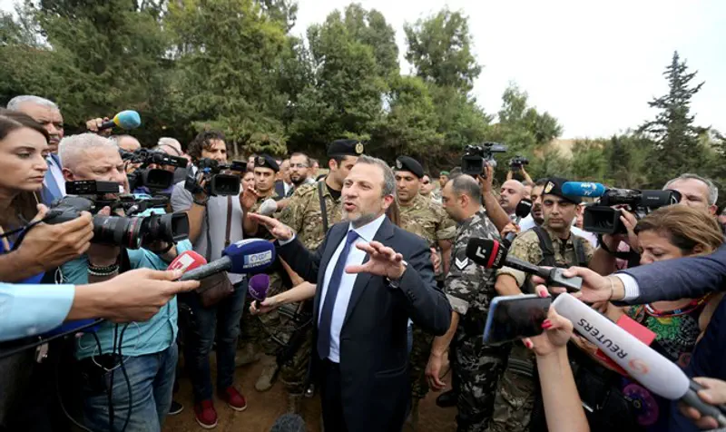Lebanese Foreign Minister Gebran Bassil gestures as he speaks during a tour