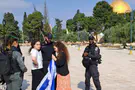Police arrested girl who hung Israeli flag over her shoulders