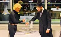 Hanukkah candles lit at place from which Nazi laws came