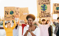 Watch: Climate activists protest atop Berlin’s Brandenburg Gate