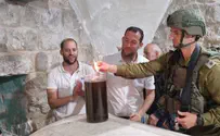 Small group of worshipers enter Joseph's Tomb