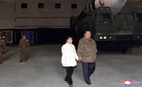 Kim Jong-Un seen with daughter at missile launch site
