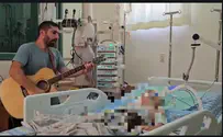 Singer Avihai Hollender plays at his 7-year-old nephew's bedside