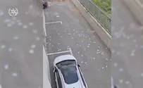 Watch: Tens of thousands of shekels thrown out the window