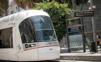 Protesters handcuff themselves to Tel Aviv streetcar