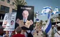 Protest sign compares Netanyahu to Hitler