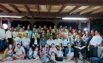 Japanese religious group visits Jerusalem Rabbi's sukkah