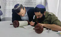 Hostages' families complete Torah scroll