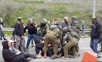 Officer suspended for beating Samaria protester