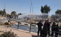 Police use water canons against activists blocking aid trucks
