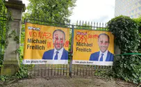 Jewish PM's campaign signs defaced with swastikas