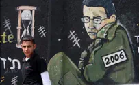 Hamas Terrorist Parades as Shalit – Handcuffed and Uniformed  