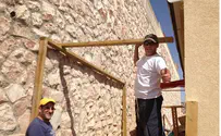Volunteers Help Build Sukkahs in Rebuilt Migron 