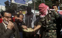 Pictures: Palestinians Celebrate Jerusalem Synagogue Slaughter