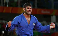 Bronze medalist donates jacket to benefit disabled children  