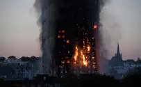 Skyscraper goes up in flames, trapping hundreds