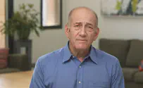 Olmert: Government giving in instead of defeating Hamas