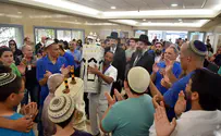 Terror attack survivor donates Torah scroll to hospital