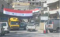דגל סוריה הונף בגאווה מול הפרלמנט בטורונטו