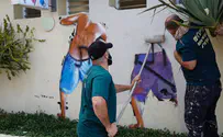 Tel Aviv removes iconic mural of peeping Toms