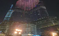 Watch: Hanukkah candle lighting below world's tallest building 
