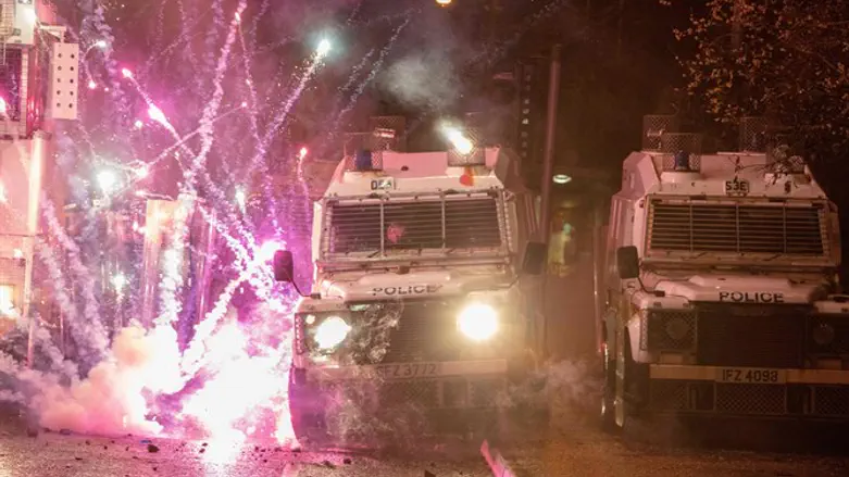 Fireworks thrown by rioters explode on police vehicles in Belfast, April 8, 2021