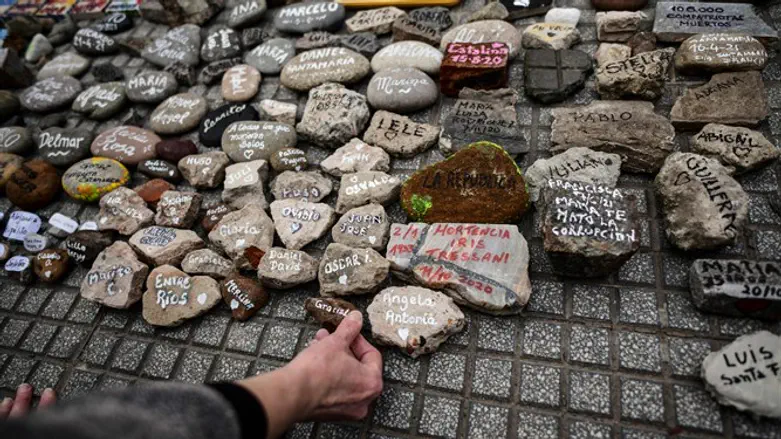 Stones placed on a memorial for COVID-19 victims in Buenos Aires
