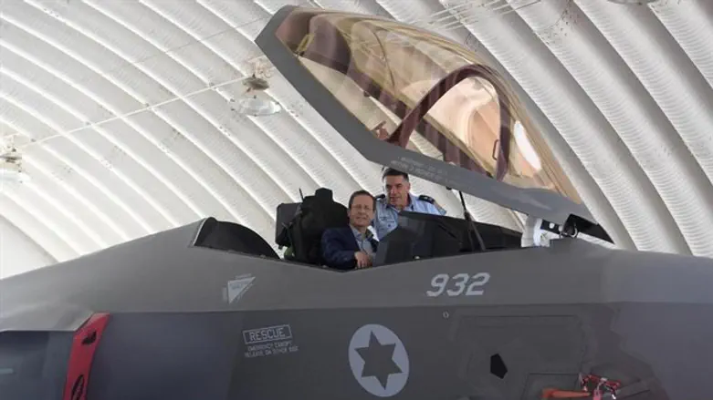 President Isaac Herzog reconstructing a photo of his father on an IAF jet