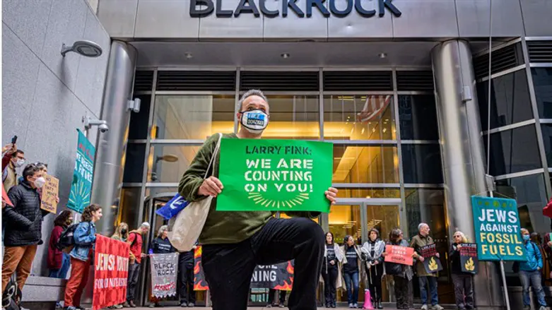 Protester in front of BlackRock headquarters