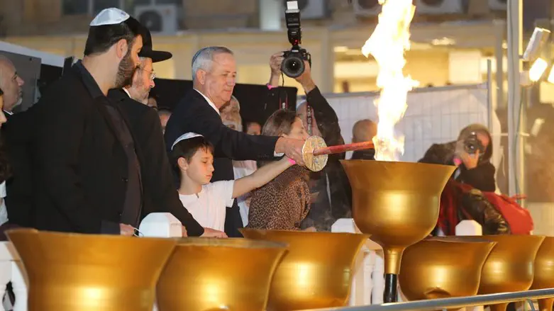 Lighting candle at Western Wall
