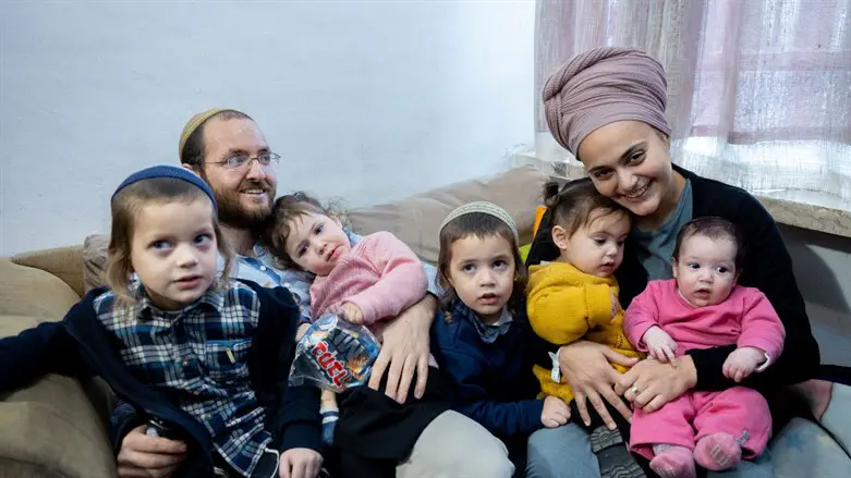 Moriya and Dvir Cohen, and their children, in their home in the Shimon Hatzadik neighborho
