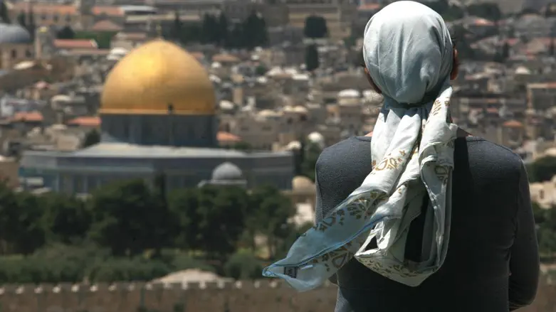 Jewish woman prays on Mount of Olives, overlooking Temple Mont