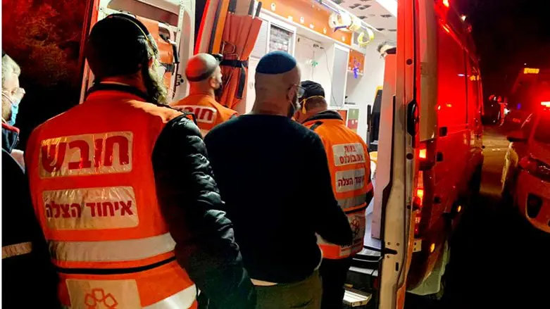 United Hatzalah volunteers loading patient onto ambulance