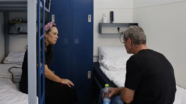 Yael Eckstein, President of the IFCJ, speaks with a shelter resident.