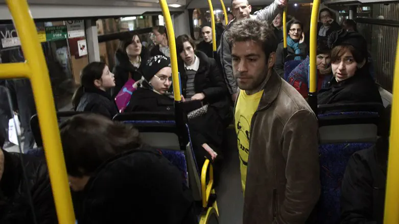 Secular Israelis board a separate bus in protest of separate seating, January 2012