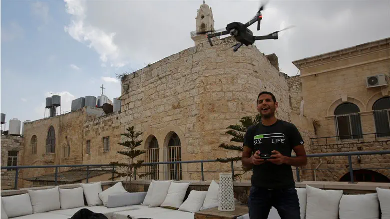 Nuseir Yassin flies his drone in the Old City of Bethlehem