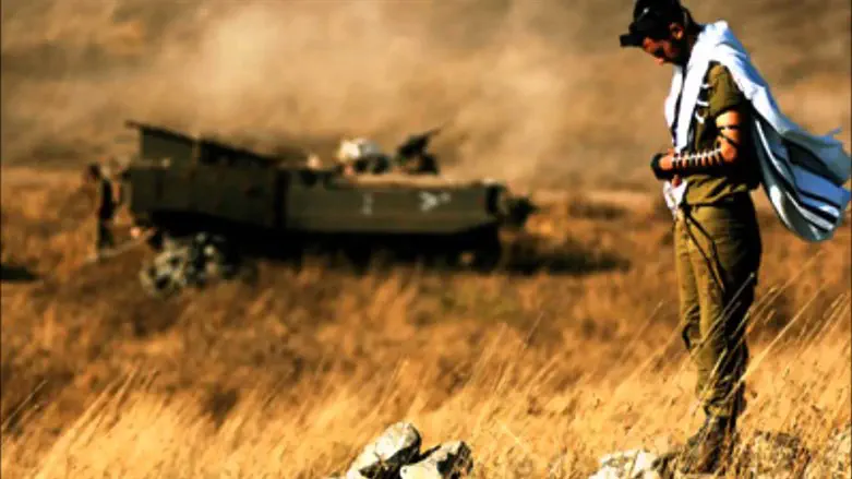 An IDF soldier on the southern military border with tefillin